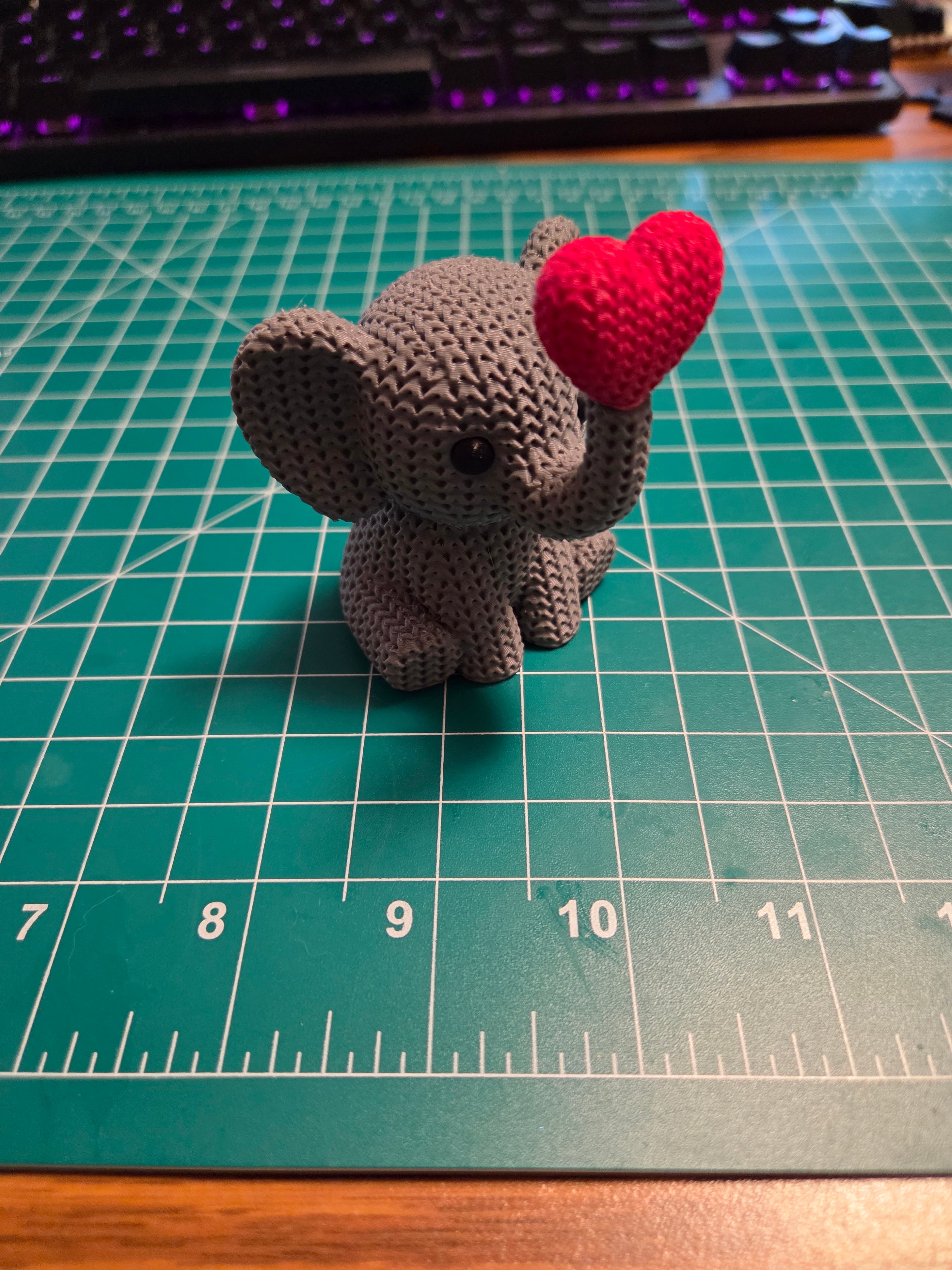 Knitted Texture Elephant Holding Heart Figurine | 3D Printed Animal Decor, Animal Lover Collectible